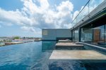 The first rooftop pool at the IT Residences with water beds